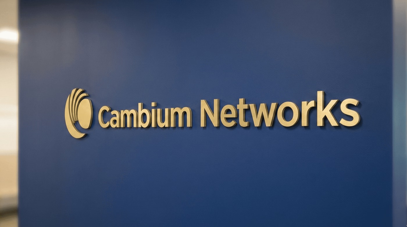 Brushed gold dimensional letters with Cambium Networks logo mounted on blue lobby wall