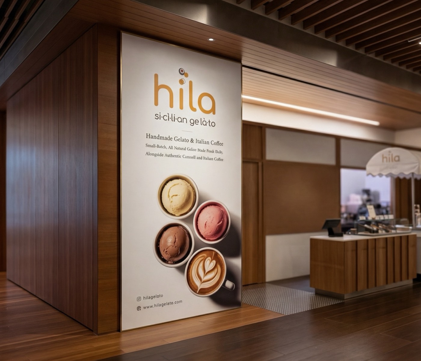 Full-height Hila branded graphic panel integrated into a wood office interior
