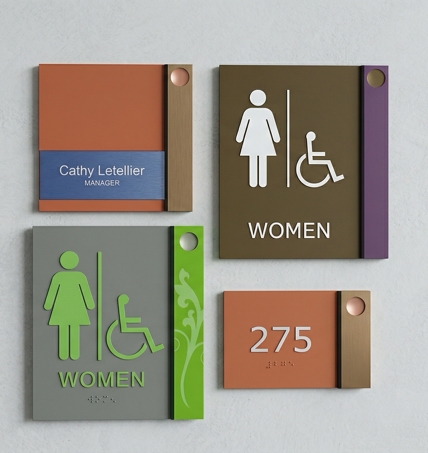 Colorful ADA restroom and room number signs with tactile text and Braille