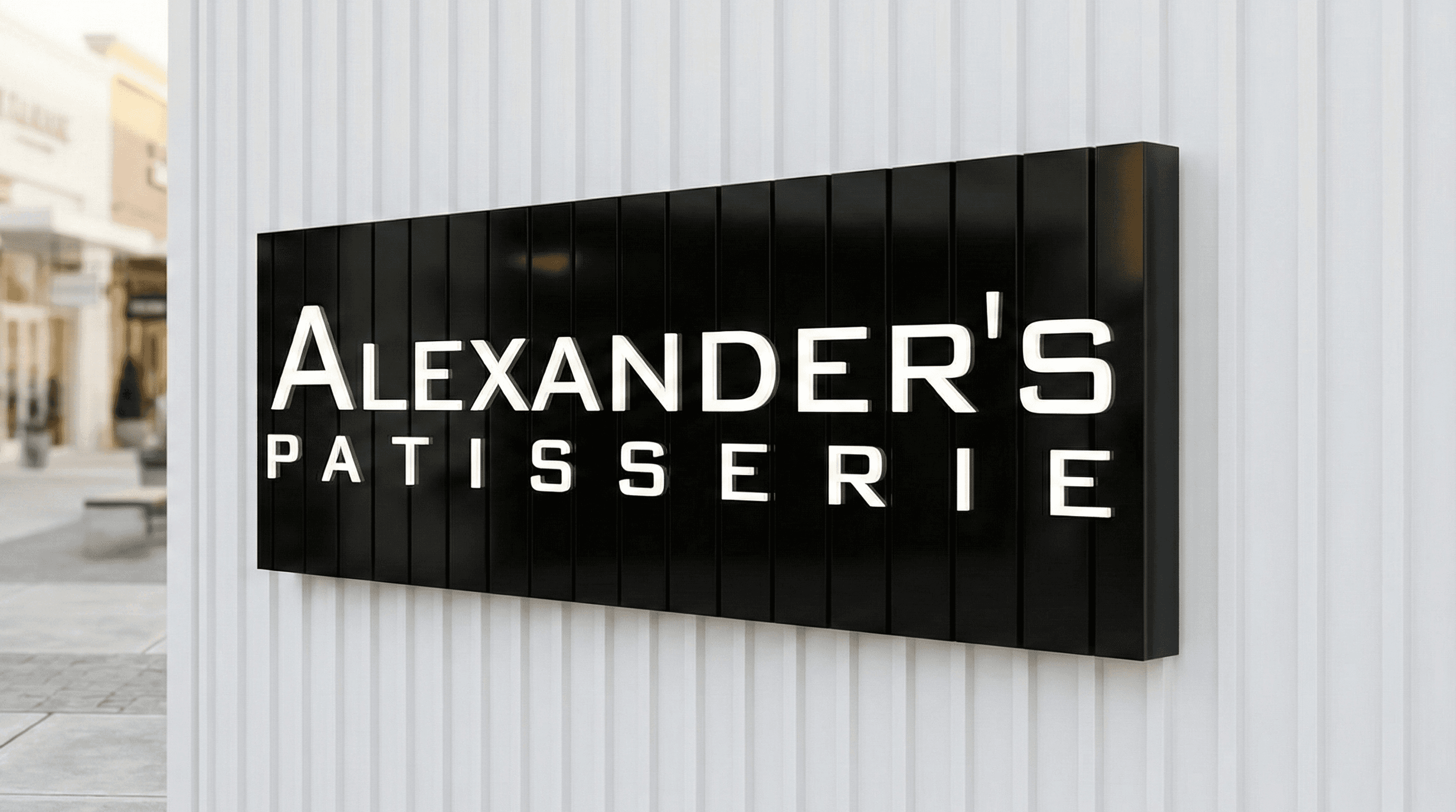 Alexander's Patisserie storefront signage with precision-cut acrylic logo lettering