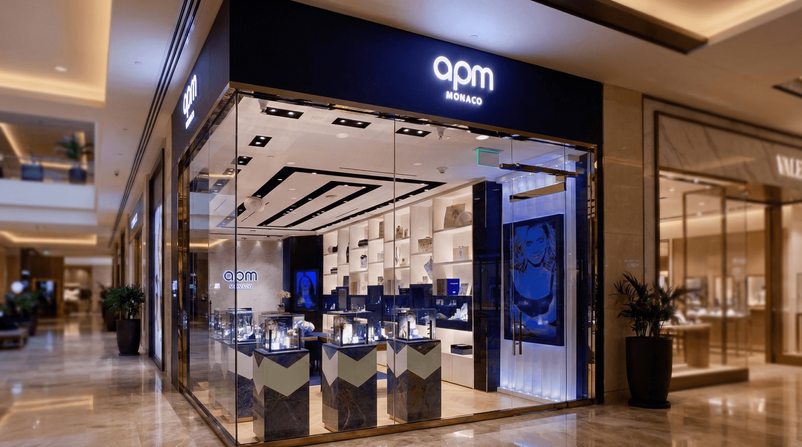 APM Monaco luxury retailer channel letters in mirror-finish stainless steel