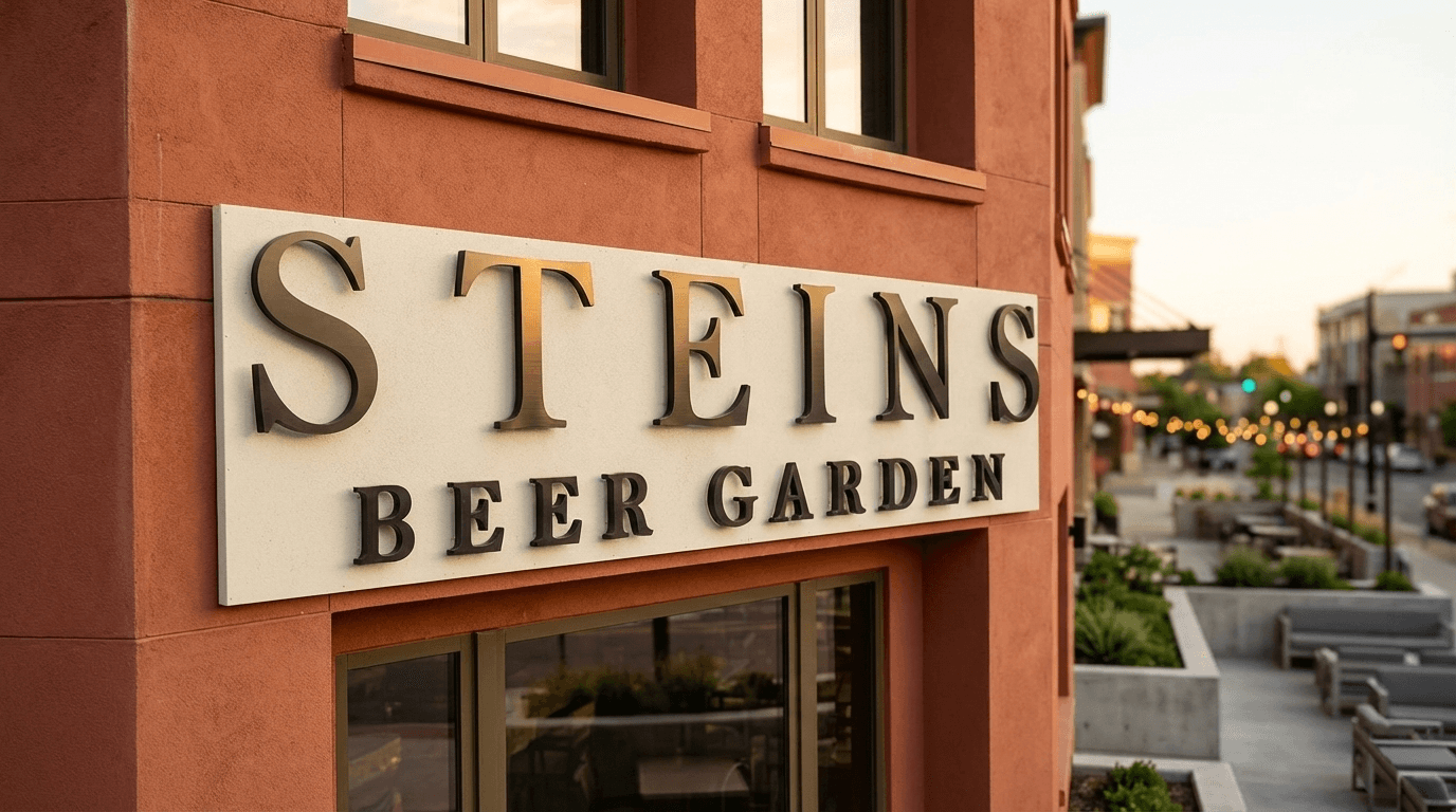 Steins Beer Garden exterior halo-lit metal sign with warm inviting lighting at night